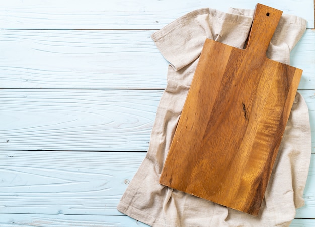 empty cutting wooden board with kitchen cloth