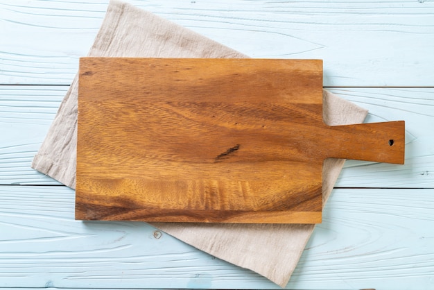 empty cutting wooden board with kitchen cloth