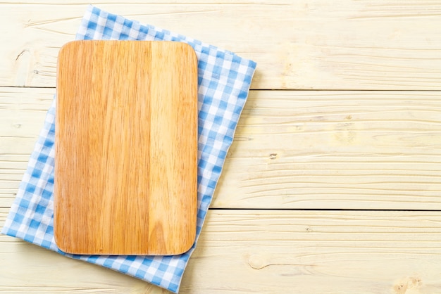 empty cutting wooden board with kitchen cloth