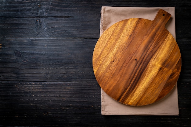 empty cutting wooden board with kitchen cloth