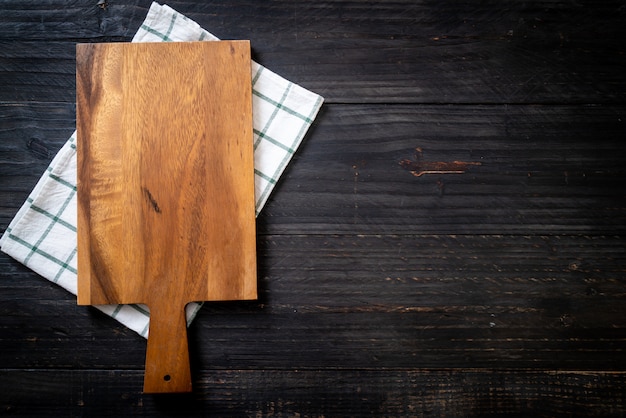 empty cutting wooden board with kitchen cloth