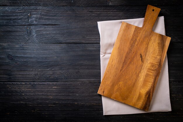 empty cutting wooden board with kitchen cloth