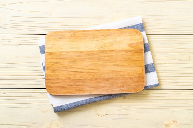 empty cutting wooden board with kitchen cloth