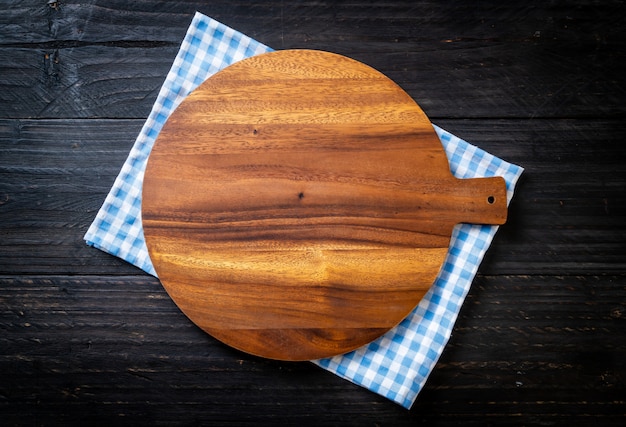 empty cutting wooden board with kitchen cloth