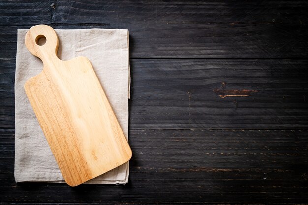 empty cutting wooden board with kitchen cloth