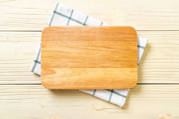 empty cutting wooden board with kitchen cloth