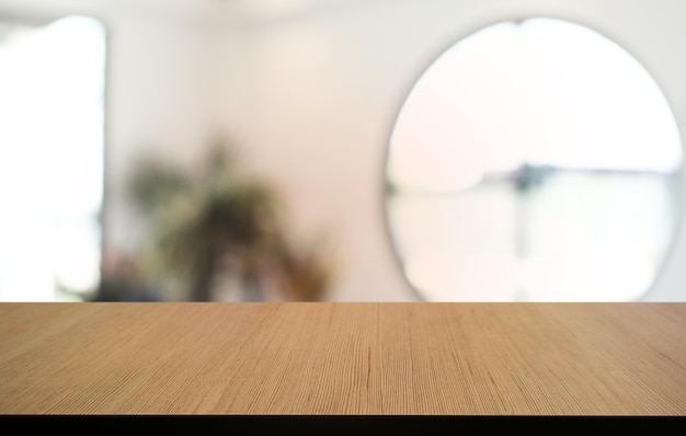 Empty dark wooden table in front of abstract blurred bokeh background of restaurant can be used for display or montage your productsMock up for space