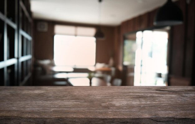 Empty dark wooden table in front of abstract blurred bokeh background of restaurant can be used for display or montage your productsMock up for space