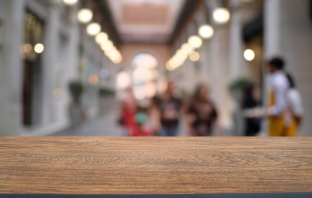 Photo empty dark wooden table in front of abstract blurred bokeh background of restaurant can be used for display or montage your productsmock up for space