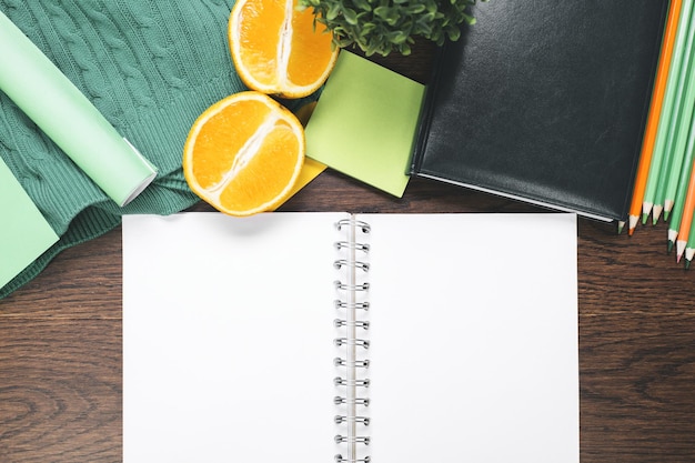Empty diary and fruit on desktop