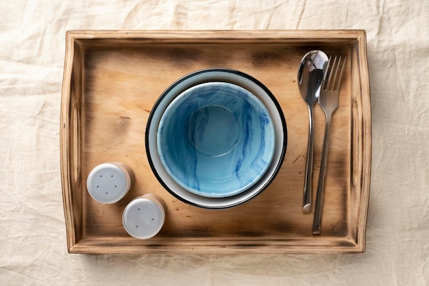 Empty dinner bowls in a wooden serving box