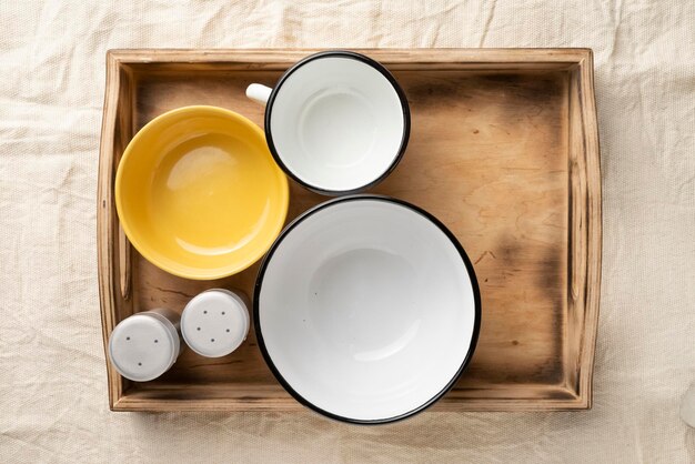 Empty dinner bowls in a wooden serving box