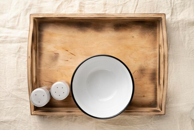 Empty dinner bowls in a wooden serving box