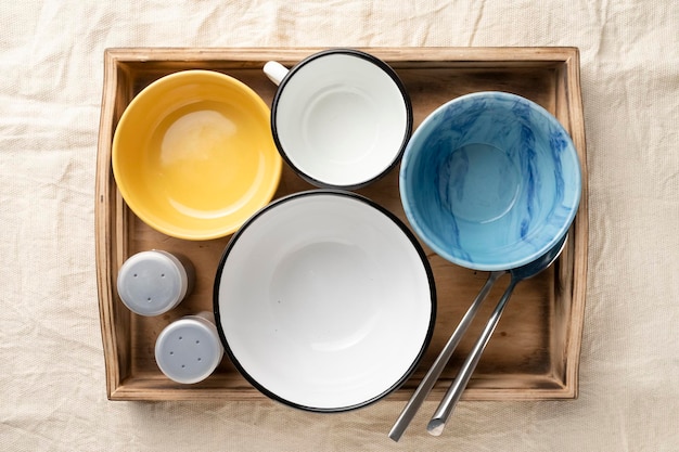 Empty dinner bowls in a wooden serving box