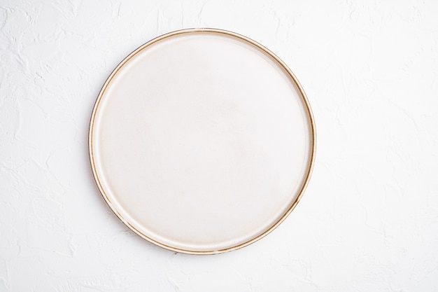 Empty dinner plate set with copy space for text or food with copy space for text or food, top view flat lay, on white stone table background