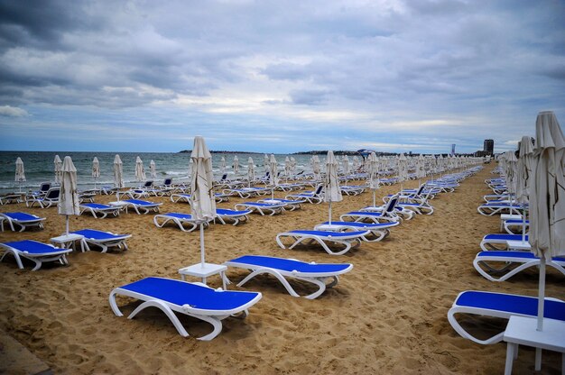 empty empty beach with folded beach umbrellas