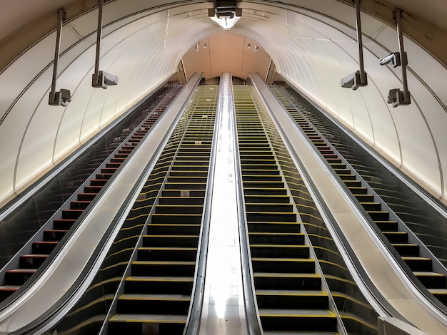 An empty escalator in metro. Transportation of people up and down stairs