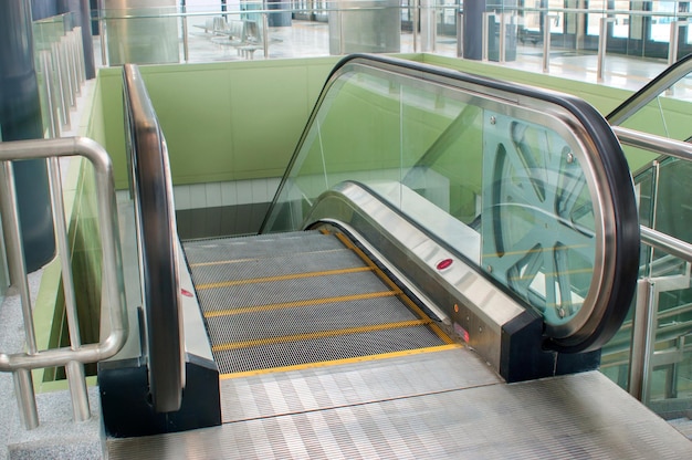 Empty escalator stairs in train station