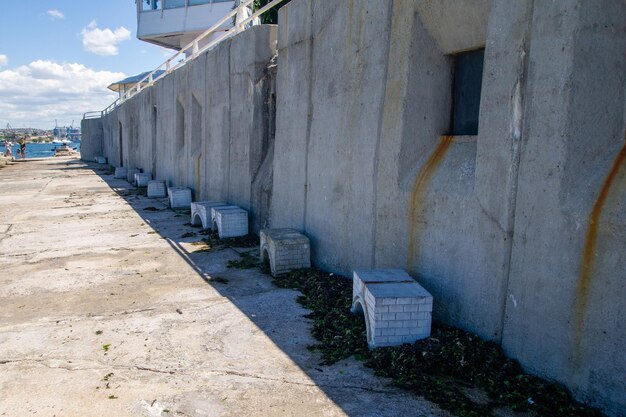 Empty footpath amidst buildings in city