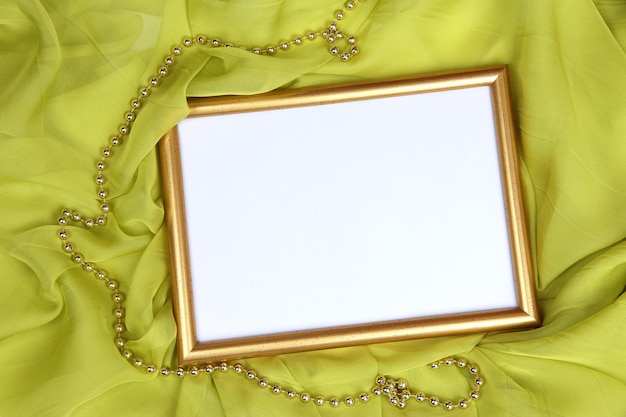 Empty frame on beautiful silk background