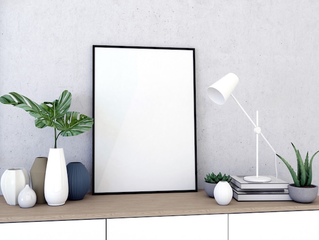 Empty frame with monstera branches on table