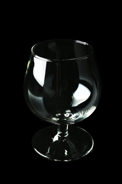 Empty glass on black background