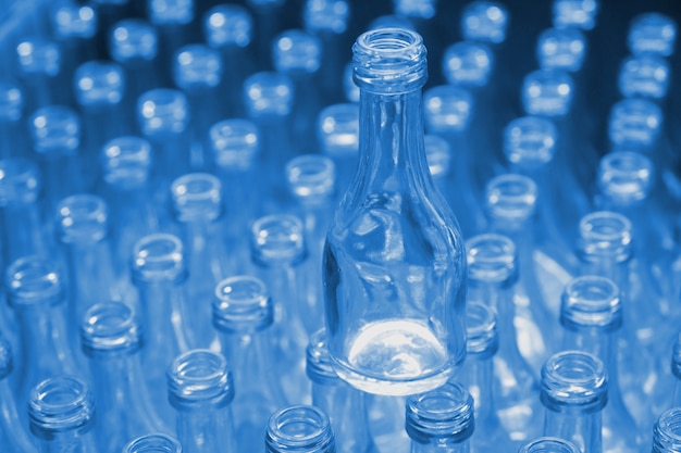 Empty glass bottles blue color in factory.