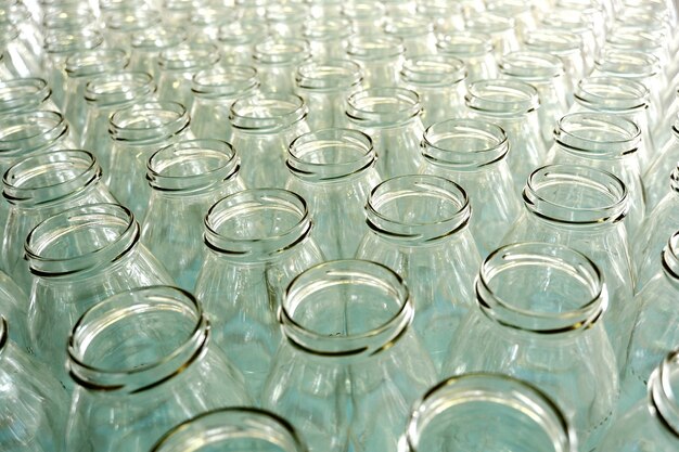 Empty glass bottles in a bottling plant or store