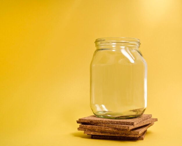 Empty glass jar on small cork trivets