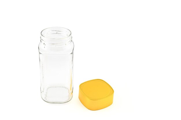 empty glass jar with yellow plastic screw cap