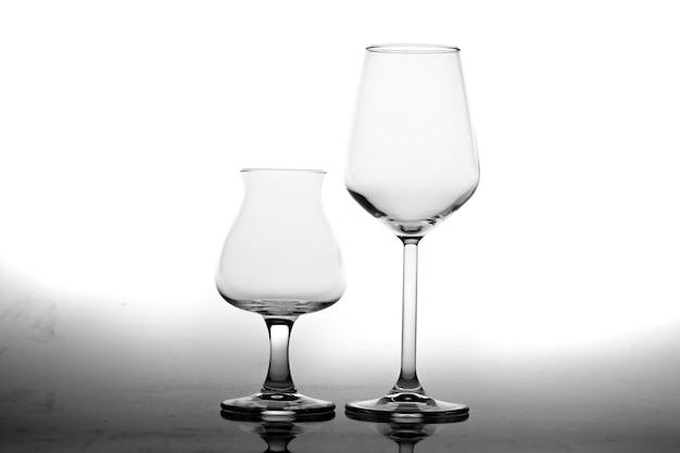 Photo empty glasses and reflection isolated on white