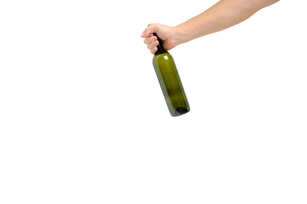 Empty, green, glass wine bottle in hand on a white background, isolate.