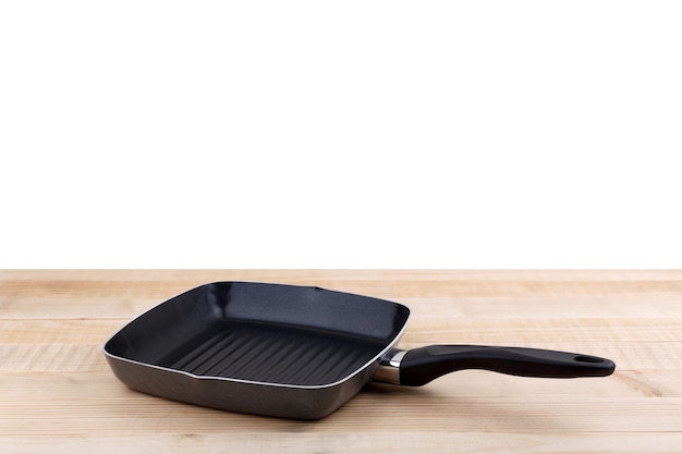 Empty grill pan on wooden table