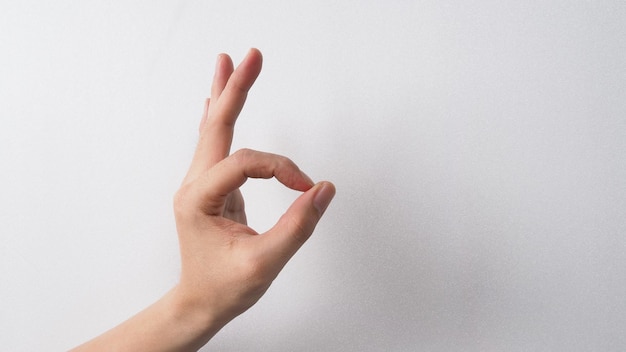 Empty hand do ok sign on white background