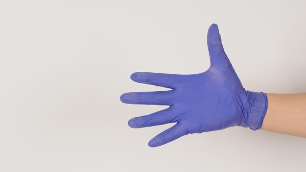 Empty Hand wear purple latex gloves on white background