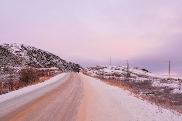 Empty highway between the Arctic hills Teriberka, Russia