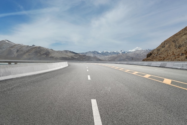 Empty highways and distant mountains