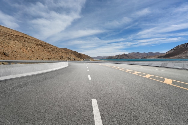 Empty highways and distant mountains