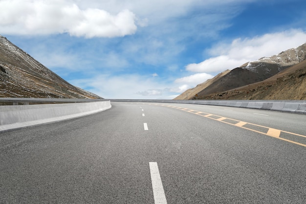 Empty highways and distant mountains