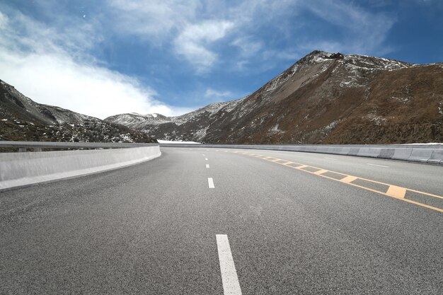 Empty highways and distant mountains