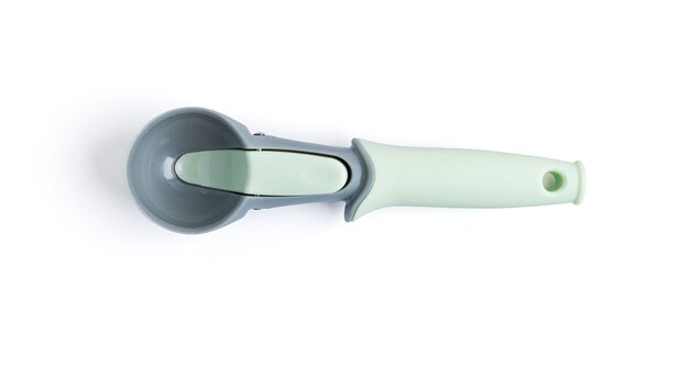 Empty ice cream spoon on white space