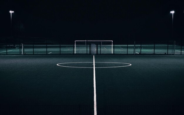 Empty illuminated court at night