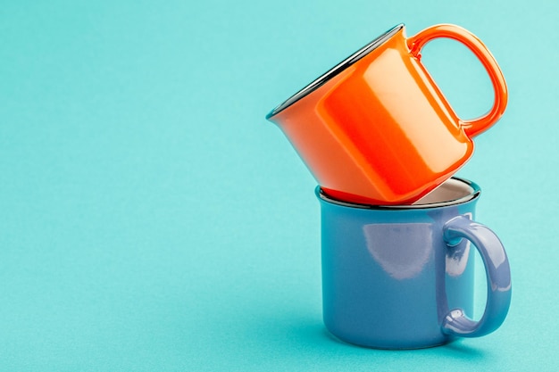 Empty iron mug on a blue background