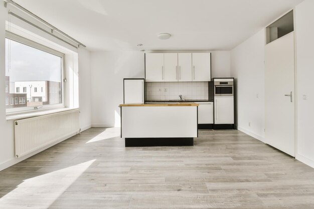 Premium Photo | An empty kitchen with white cabinets and black ...
