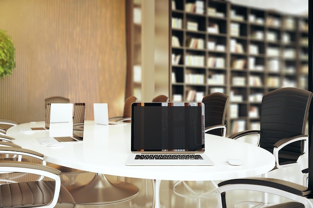 Empty laptop on conference table