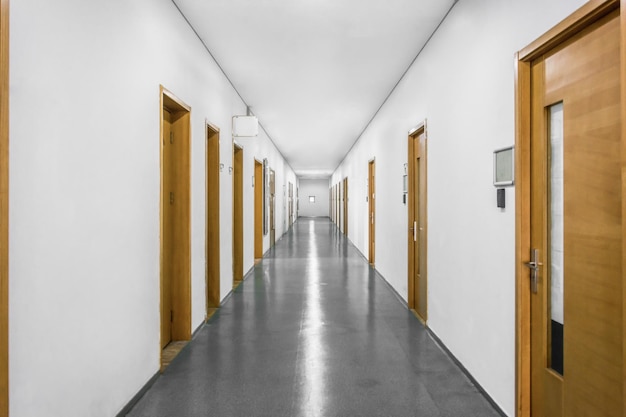 Empty long corridor in the modern office building