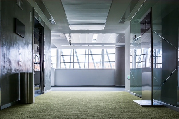 Empty long corridor in the modern office building