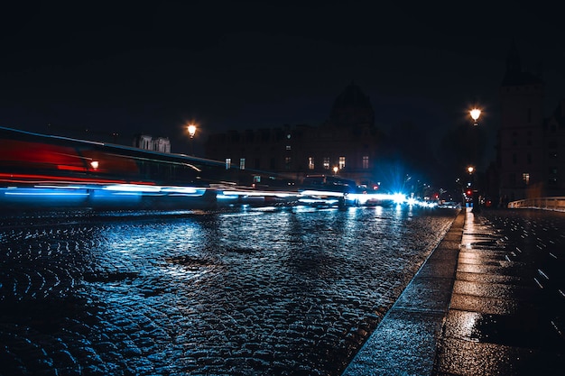 Empty long exposure light trail shot road view from a Paris Street for design background during night