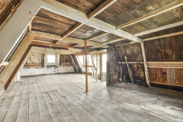 Empty mansard room with window