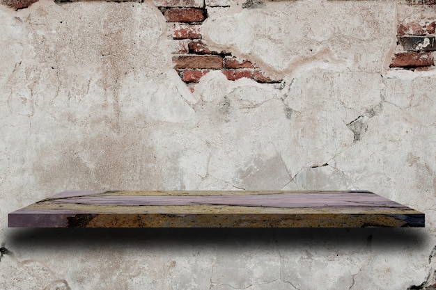 Photo empty marble shelf on old white cement wall texture.